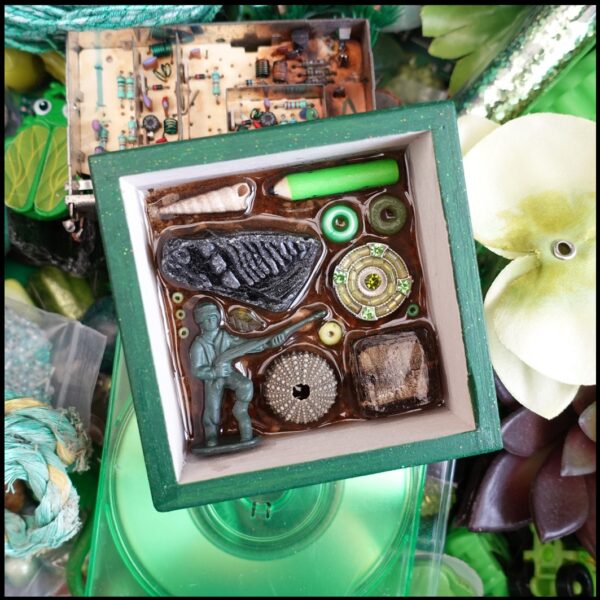 green salvage square of recycled manmade and natural stuff