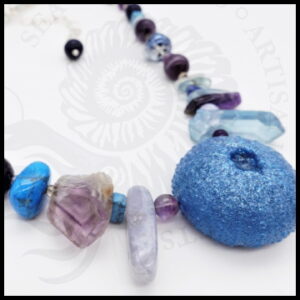 handmade resin necklace with blue gemstones