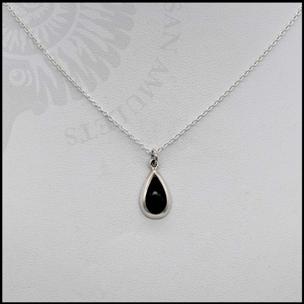 image of tiny whitby jet pendant on chain