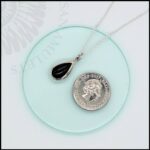 image of tiny whitby jet necklace