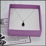 image of tiny whitby jet necklace