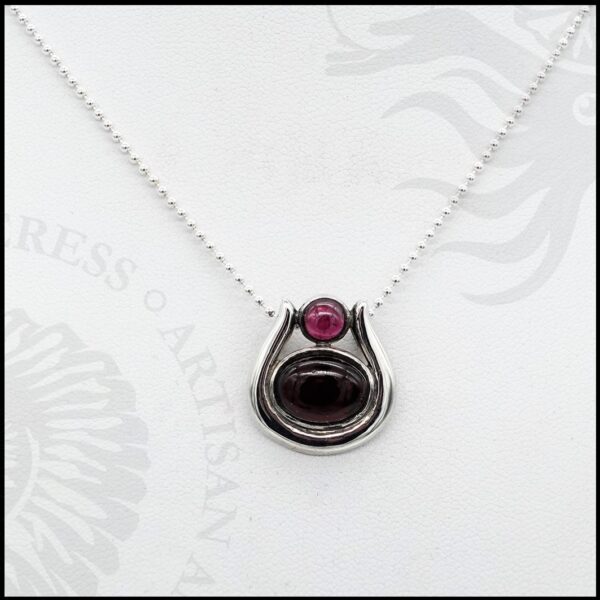 sterling silver necklace with round and oval garnet cabochons